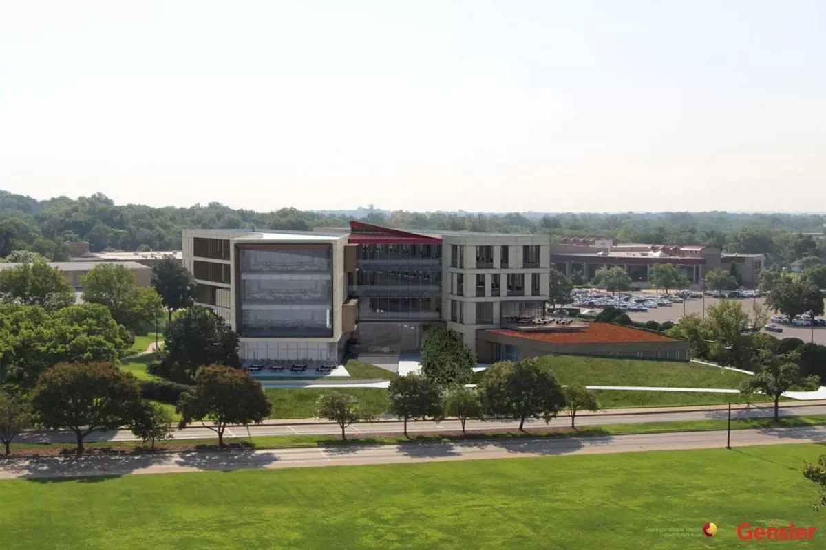 A view of the exterior of the Kansas University School of Business on a sunny day.